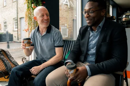 John and a participant having a conversation